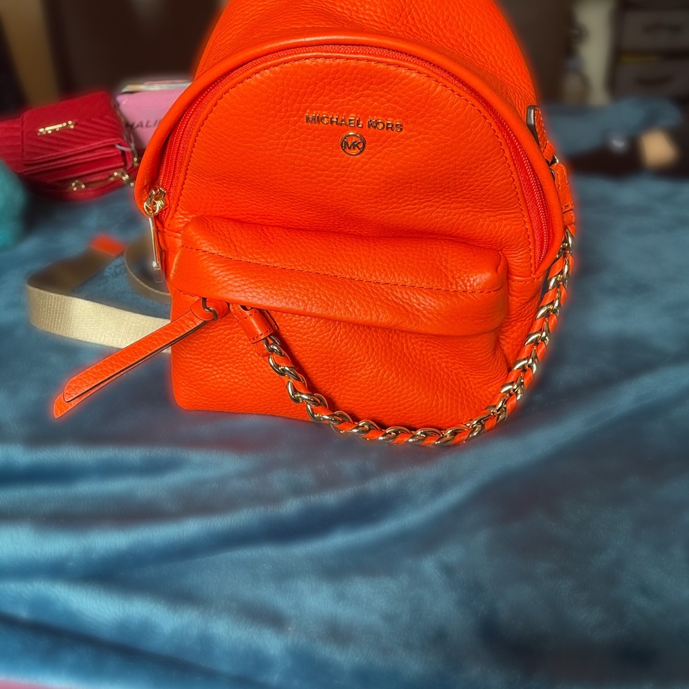 Michael Kors Bright Orange Pebbled Leather Mini Backpack with Chain Detail